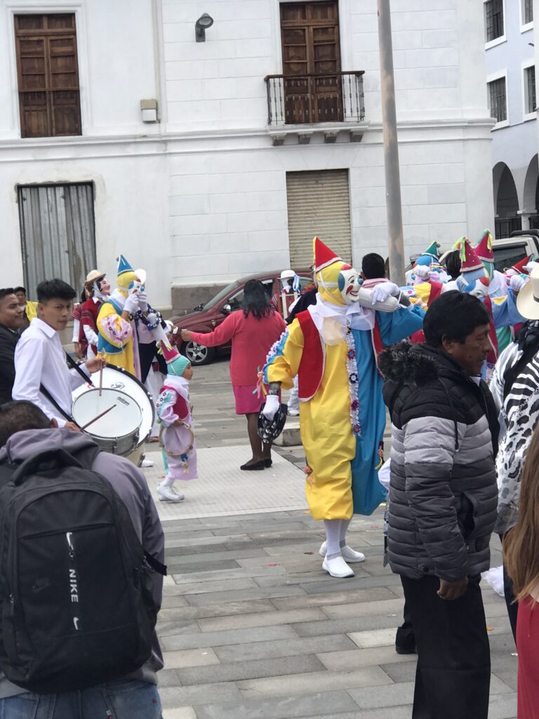 A parade of dancing clowns in Quito