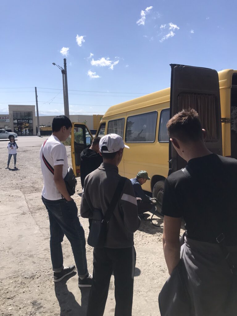 A broken down marshrukta on the road in Kyrgyzstan