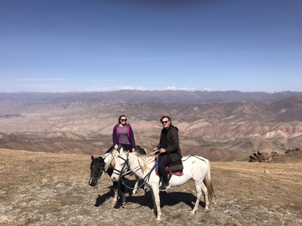 Riding a horse at the Kyzart Pass