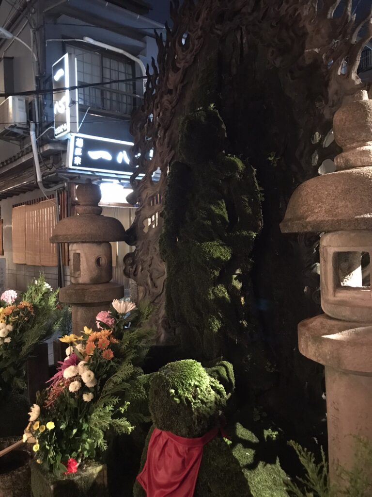 A moss-covered Buddha statue at Hozen-ji in Osaka